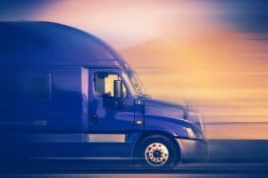 36287528 - rush trucking. speeding blue semi truck on the american highway. trucking concept.